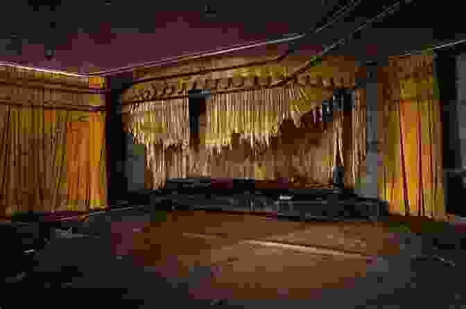 Abandoned Theater Stage With Torn Curtains And Faded Spotlights Abandoned In Place Andrew Gregory